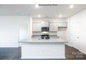 Modern kitchen featuring granite countertops and stainless steel appliances at 8047 Plymouth Dr, Sherrills Ford, NC 28673