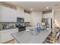 Modern kitchen with gray countertops and stainless steel appliances at 11838 Midnight Way, Huntersville, NC 28078