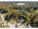 Aerial view of a two-story house on a large lot at 1403 Gentry Pl, Salisbury, NC 28146