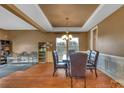 Dining room featuring hardwood floors and a large window at 5146 Elementary View Dr, Charlotte, NC 28269