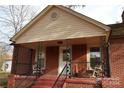 Brick home with a covered porch and metal railing at 505 Turner St, Landis, NC 28088