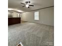 Spacious living room with carpet flooring and ceiling fan at 534 Bentley Rd, Shelby, NC 28152