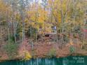 Home nestled in the woods with a lake view at 9201 Doe Ct, Charlotte, NC 28277