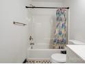 Clean bathroom with a shower/tub combo and patterned floor at 710 W Elm St, Shelby, NC 28150
