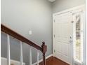 Inviting entryway with hardwood floors and staircase at 5682 Stafford Rd, Charlotte, NC 28215