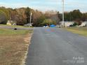 Residential street view with homes and greenery visible at 36245 Nugget Rd # 2, New London, NC 28127