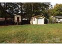 Large backyard with storage shed and a detached garage at 1572 W Lakewood Dr # 19, Rock Hill, SC 29732