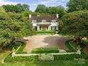 Luxury home exterior with circular driveway at 3531 Sharon Rd, Charlotte, NC 28211