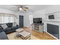 Comfortable living room with hardwood floors and fireplace at 627 Brevard St, Statesville, NC 28677