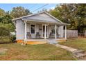 Cozy bungalow with front porch and well maintained yard at 627 Brevard St, Statesville, NC 28677