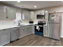 Modern kitchen featuring stainless steel appliances and white cabinets at 113 Dellinger Rd, Shelby, NC 28152