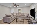 Cozy living room with sectional sofa and hardwood floors at 115 Dellinger Rd, Shelby, NC 28152