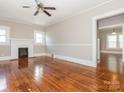 Bright living room with hardwood floors, fireplace, and ceiling fan at 1411 Lineberger Ave, Gastonia, NC 28052