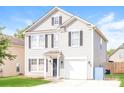 Two-story house with gray siding, a two-car garage, and a well-maintained lawn at 612 Carybrook Ct, York, SC 29745