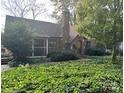 Attractive brick home with lush landscaping and a large yard at 315 Tranquil Ave, Charlotte, NC 28209