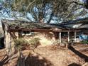 Brick ranch home with covered porch and mature trees at 4495 King Wilkinson Rd, Denver, NC 28037