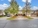 Townhome complex with multiple units and parking at 8509 Loxton Cir, Charlotte, NC 28214