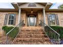 Brick home with a covered front porch and a brick staircase at 101 Hidden Cove Dr, Shelby, NC 28150