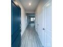 Light-filled entryway with luxury vinyl plank flooring at 2107 Morgan Hills Dr, Albemarle, NC 28001