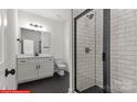 Modern bathroom with white cabinets, hex tile floor, and glass shower at 827 Flint Dr, Statesville, NC 28677