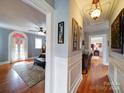 Hallway with hardwood floors and access to bedrooms at 1116 E Franklin Blvd, Gastonia, NC 28054