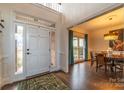 Bright two story entryway with hardwood floors and formal dining room at 17418 Sailors Watch Pl, Cornelius, NC 28031