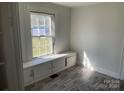 Bright bedroom with built-in window seat and storage at 223 Chester Ave, Great Falls, SC 29055
