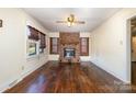 Living room with hardwood floors and a brick fireplace at 1097 W Hwy 150 None, Lincolnton, NC 28092