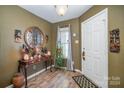 Bright entryway with hardwood floors and decorative accents at 12413 Stowe Acres Dr, Charlotte, NC 28262