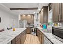 Modern kitchen with wood cabinets, granite counters, and an island at 19770 Alpine Rd, Albemarle, NC 28001