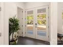 Bright entryway with double doors and dark hardwood floors at 9000 Boyd Dr, Matthews, NC 28105
