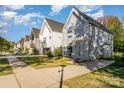 Row of modern houses with gray siding and green lawns at 4147 Merlane Dr, Charlotte, NC 28206