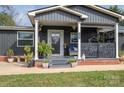 Front view of a charming ranch home with a covered porch and landscaping at 4298 Maiden Hwy, Lincolnton, NC 28092