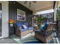 Relaxing front porch with wicker furniture and lush greenery at 4298 Maiden Hwy, Lincolnton, NC 28092
