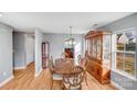 Formal dining room featuring hardwood floors and a large hutch at 7633 Shiny Meadow Ln, Charlotte, NC 28215