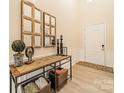 Bright entryway with wood console table, mirrors, and decorative items at 195 Stibbs Cross Rd, Mooresville, NC 28115