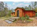 Unique wood home with arched entryway and stone steps at 2224 Taylor Rd, Shelby, NC 28152