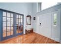 Bright and spacious entryway with hardwood floors and French doors at 119 Plantation Dr, Mooresville, NC 28117