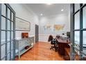 Home office with hardwood floors, built-in cabinetry, and a large desk at 119 Plantation Dr, Mooresville, NC 28117