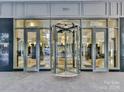 Building entrance with revolving doors at 230 S Tryon St # 205, Charlotte, NC 28202