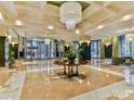 Spacious lobby featuring a large chandelier and seating area at 230 S Tryon St # 205, Charlotte, NC 28202