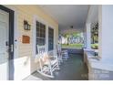 Inviting front porch featuring rocking chairs and a view of the street at 402 W 7Th St, Newton, NC 28658