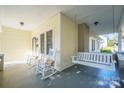 Relaxing front porch with rocking chairs and swing at 402 W 7Th St, Newton, NC 28658