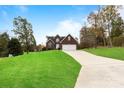 Brick house with a long driveway and green lawn at 207 Dunnbrook Dr, Salisbury, NC 28146