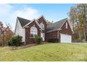 Brick house with a two-car garage and a well-manicured lawn at 207 Dunnbrook Dr, Salisbury, NC 28146