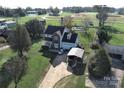 Aerial view showing two-story house, driveway, detached carport, and yard at 5425 Creekwood Dr, Salisbury, NC 28147