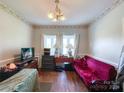 Small dining room with wood floors, window seat, and a couch at 5425 Creekwood Dr, Salisbury, NC 28147
