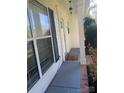 Front entrance with gray concrete porch and black shutters at 107 Monterey Dr, Mooresville, NC 28117