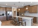 Modern kitchen with light brown cabinets and a large island at 8928 Connover Hall Ave, Charlotte, NC 28215