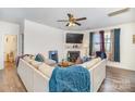 Spacious living room with sectional sofa, fireplace, and large TV at 1628 Savory Ln, Charlotte, NC 28216